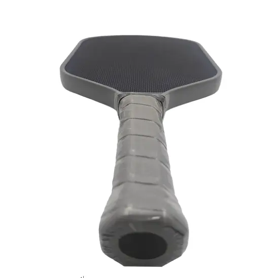 Close-up of the ergonomic grip and handle of an ApexonSport Titanium Pickleball Paddle, engineered for comfort and stability.