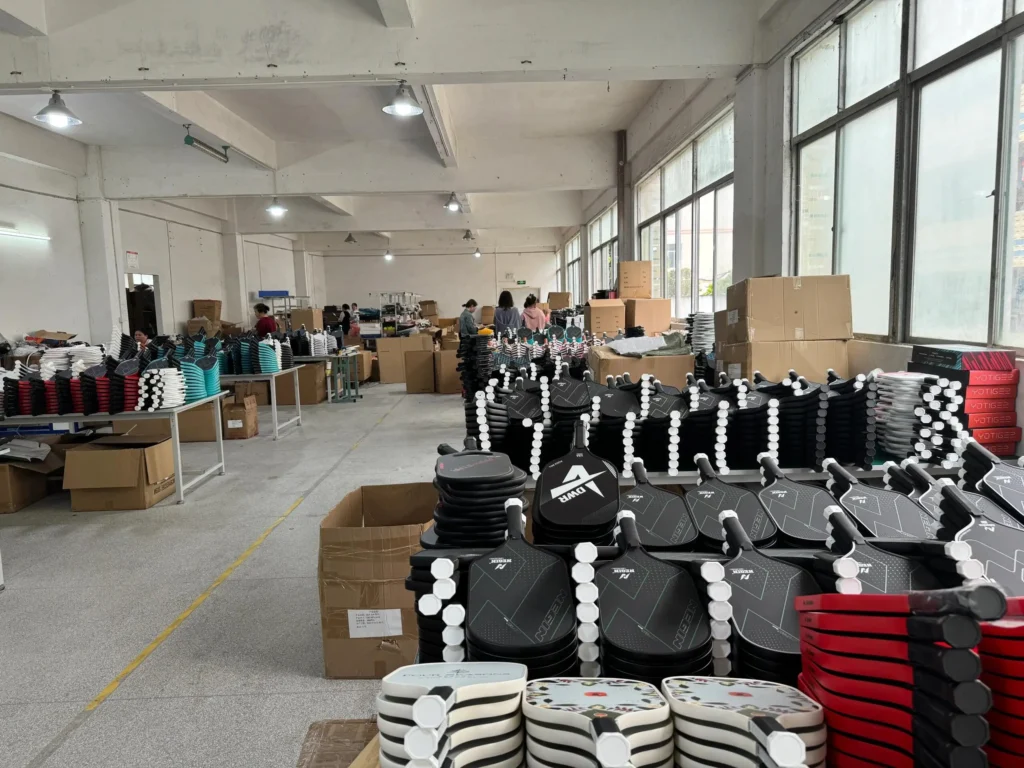 Bulk pickleball paddles ready for wholesale export at Apexon Sport OEM manufacturer warehouse in China