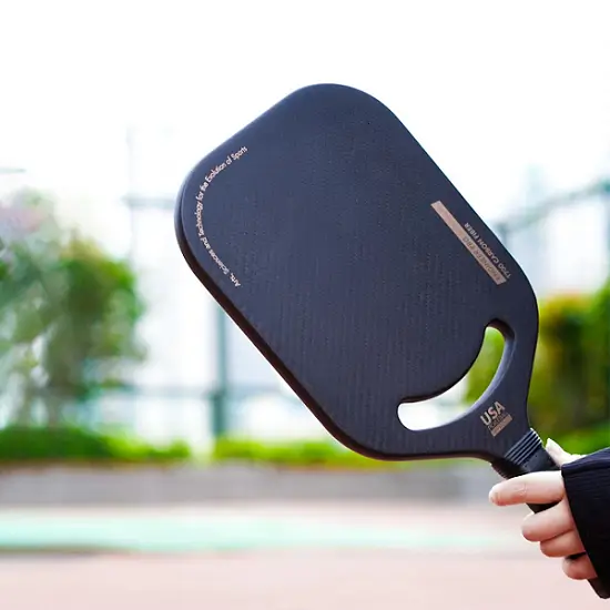 ApexonSport edgeless thermoformed pickleball paddle, showcasing the seamless aerodynamic rim and T700 carbon fiber surface for advanced performance.